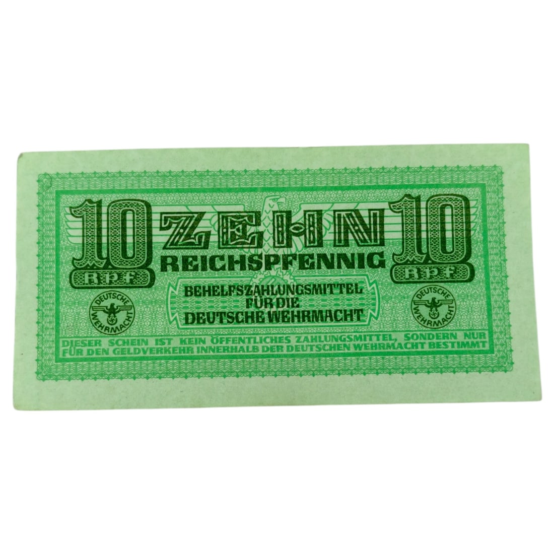 German WWII Wehrmacht 10 Reichspfennig Military Payment Note: A 10 Reichspfennig "Behelfszahlungsmittel für die Deutsche Wehrmacht" military payment certificate, printed in orange and red with the denomination "10 FÜNFZIG REICHSPFENNIG" repeated across