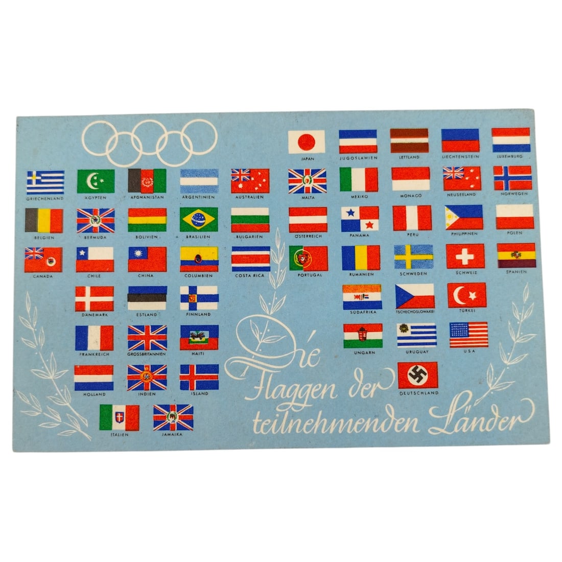 1936 Berlin Olympics Postcard "Die Flaggen der teilnehmenden Länder": A postcard published by Reichssportverlag, Berlin, titled "Die Flaggen der teilnehmenden Länder" (The Flags of the Participating Countries), printed for the 1936 Berlin Olympic Games. The front depic