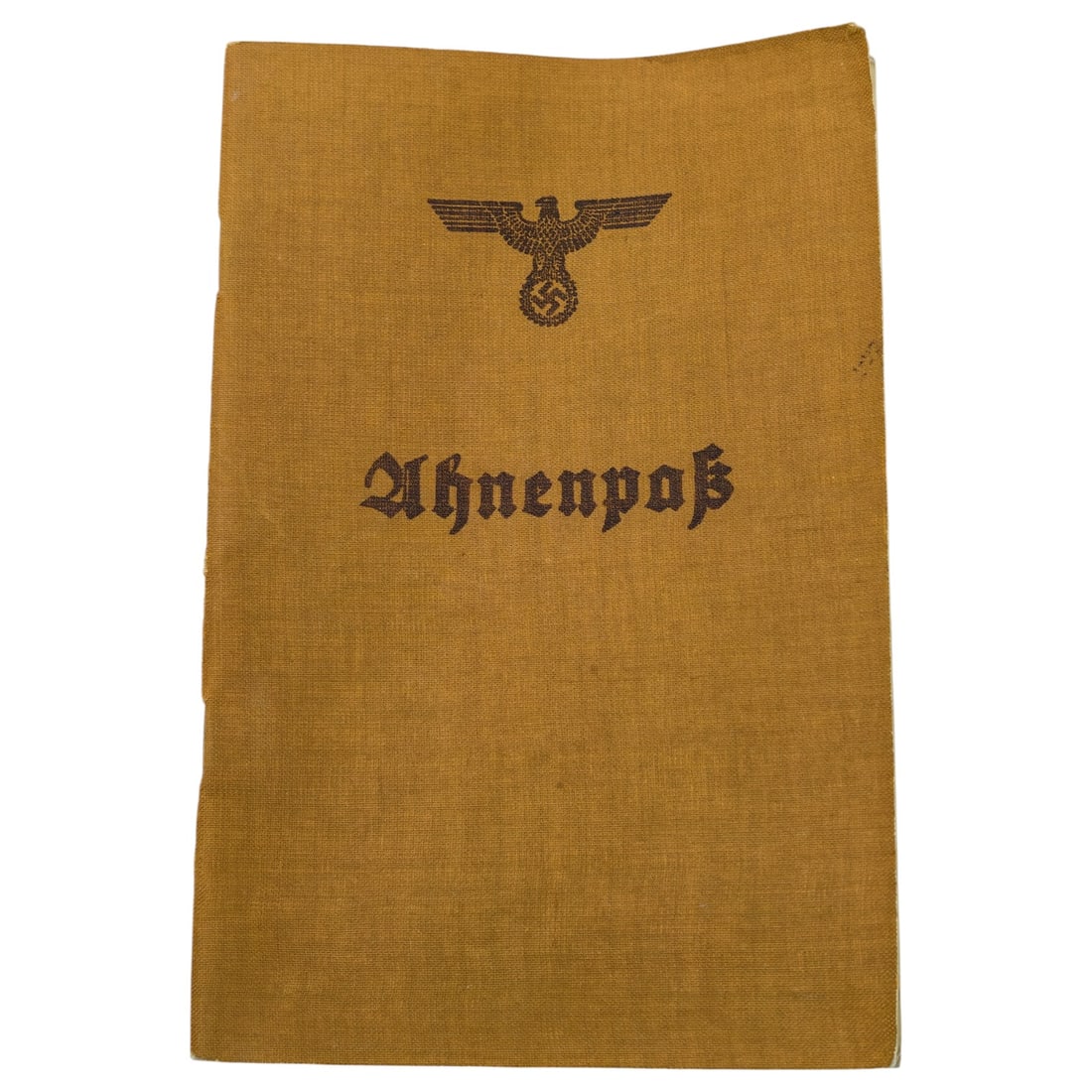 German WWII Ahnenpaß (Ancestor Passport) Booklet: A genealogical record booklet issued in Nazi Germany, with a cloth cover printed with an eagle and swastika emblem above the title "Ahnenpaß" in Fraktur script. The title page repeats the eagle and s