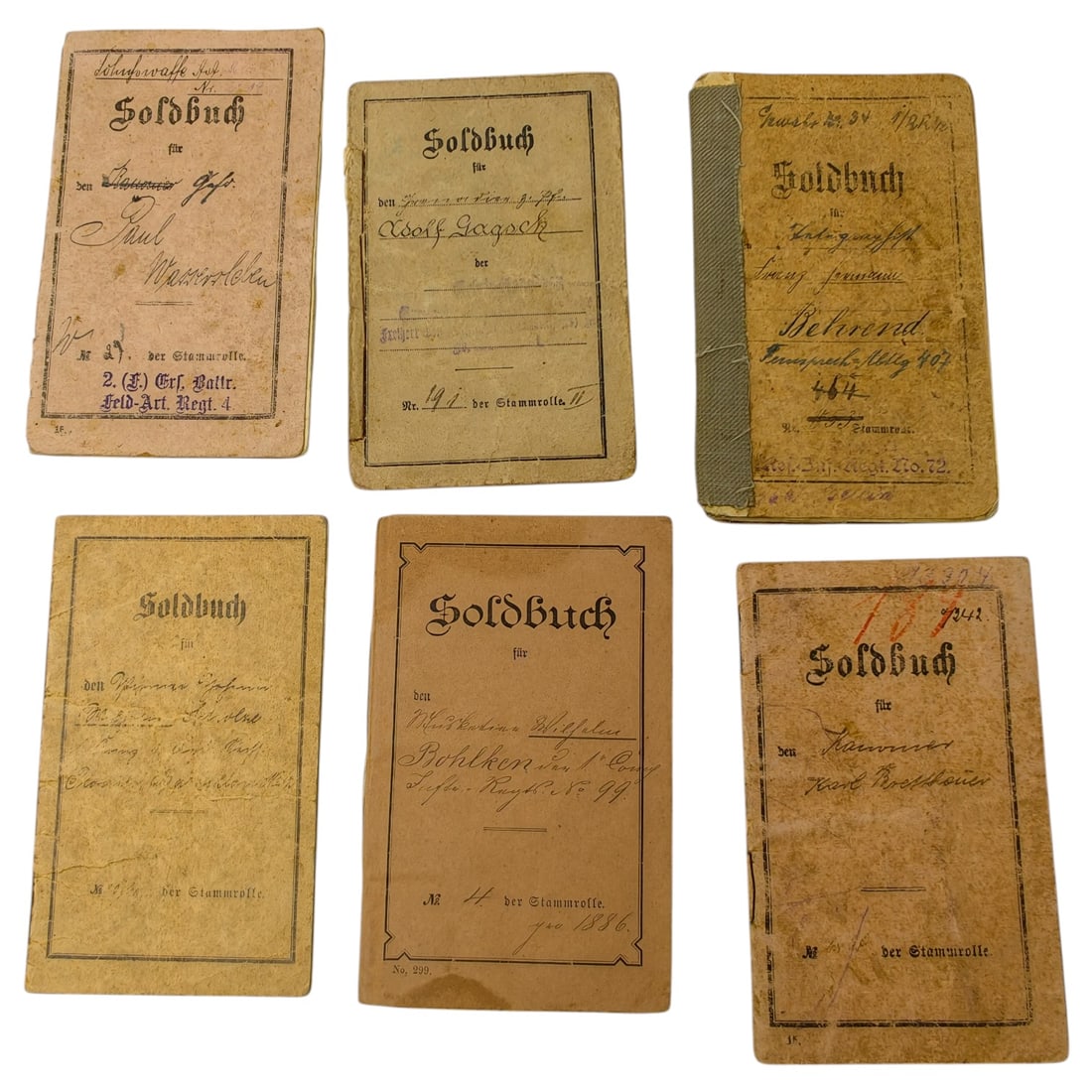 Set of Imperial German Soldbuch Military Pay Books: A set of Imperial German soldier's pay books (Soldbuch), each issued to an individually named soldier and inscribed with unit designations and Stammrolle (roll) numbers. Named recipients and units inc