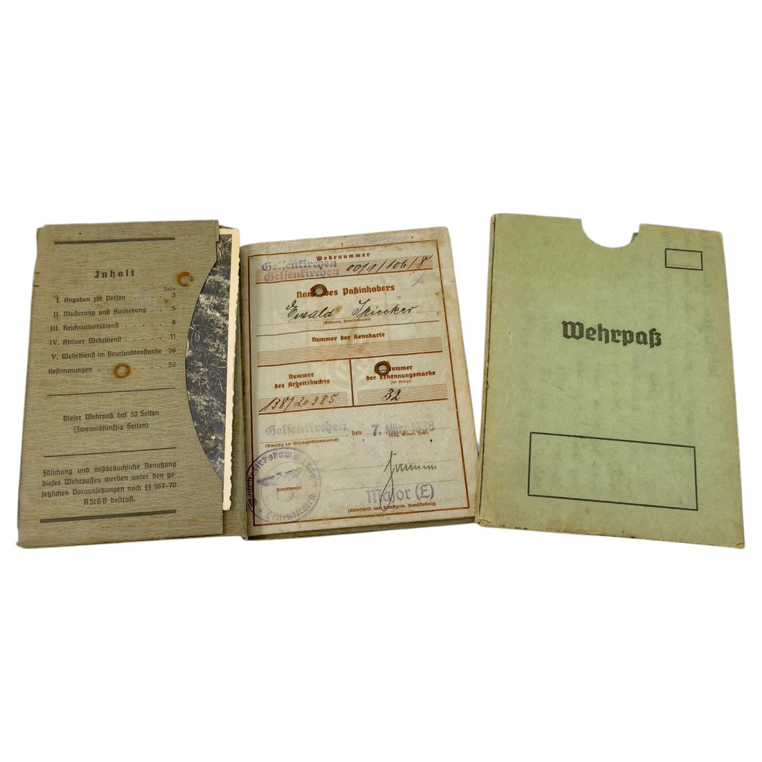 German WWII Wehrpass Military Service Record Books with Personal Documents: This lot comprises a Wehrpass booklet, the standard Wehrmacht service record book issued to German servicemen, printed grey card covers and internal pages for personal data, mobilization, and service 