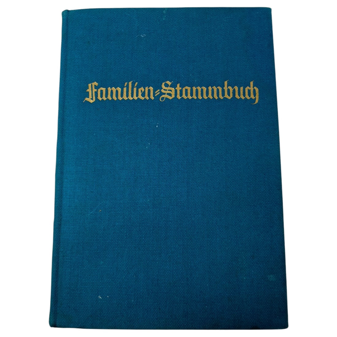 German Family Register Book (Familien-Stammbuch) by Bertelsmann Verlag: A German family record book bound in blue cloth with gilt Gothic-script title lettering to the front board. The title page bears the printed heading "Familien-Stammbuch" along with a handwritten famil