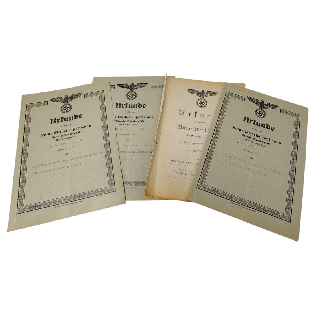 Set of German Third Reich Notarial Urkunde Documents, Nürnberg: A set of official German notarial certificates ('Urkunde') printed with the national eagle and swastika emblem at the head, issued by notaries including Wilhelm Hoffmann of Notariat Nürnberg V and No