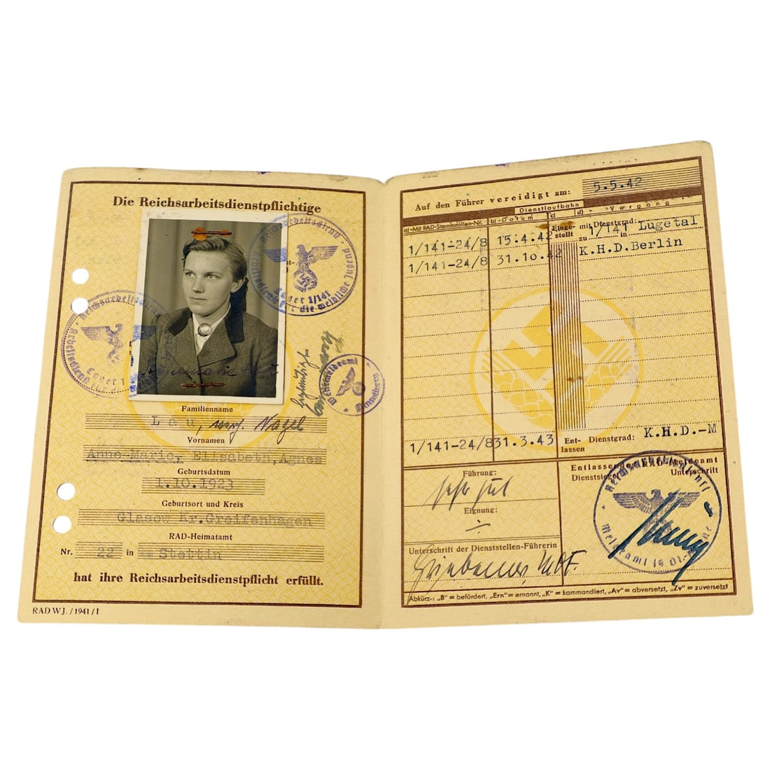 German WWII Reichsarbeitsdienst-Paß for the weibliche Jugend, Named Document: A Reichsarbeitsdienst identification pass issued to a female member of the Reich Labor Service, printed with the RAD emblem of crossed rye sheaves over a swastika on the cover, titled "Reichsarbeitsdi