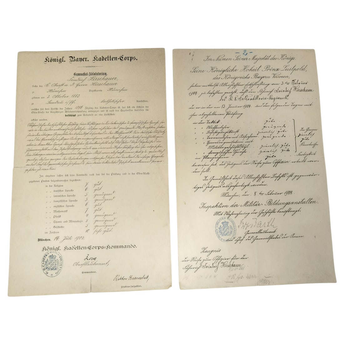 Königlich Bayerisches Kadetten-Corps Documents for Siegfried Hirschauer: A set of two Royal Bavarian Kadetten-Corps documents issued to Siegfried Hirschauer, son of a Royal Colonel and Herr Hirschauer, born October 3, 1883 in München. The first is a Gymnasial-Absolutorium