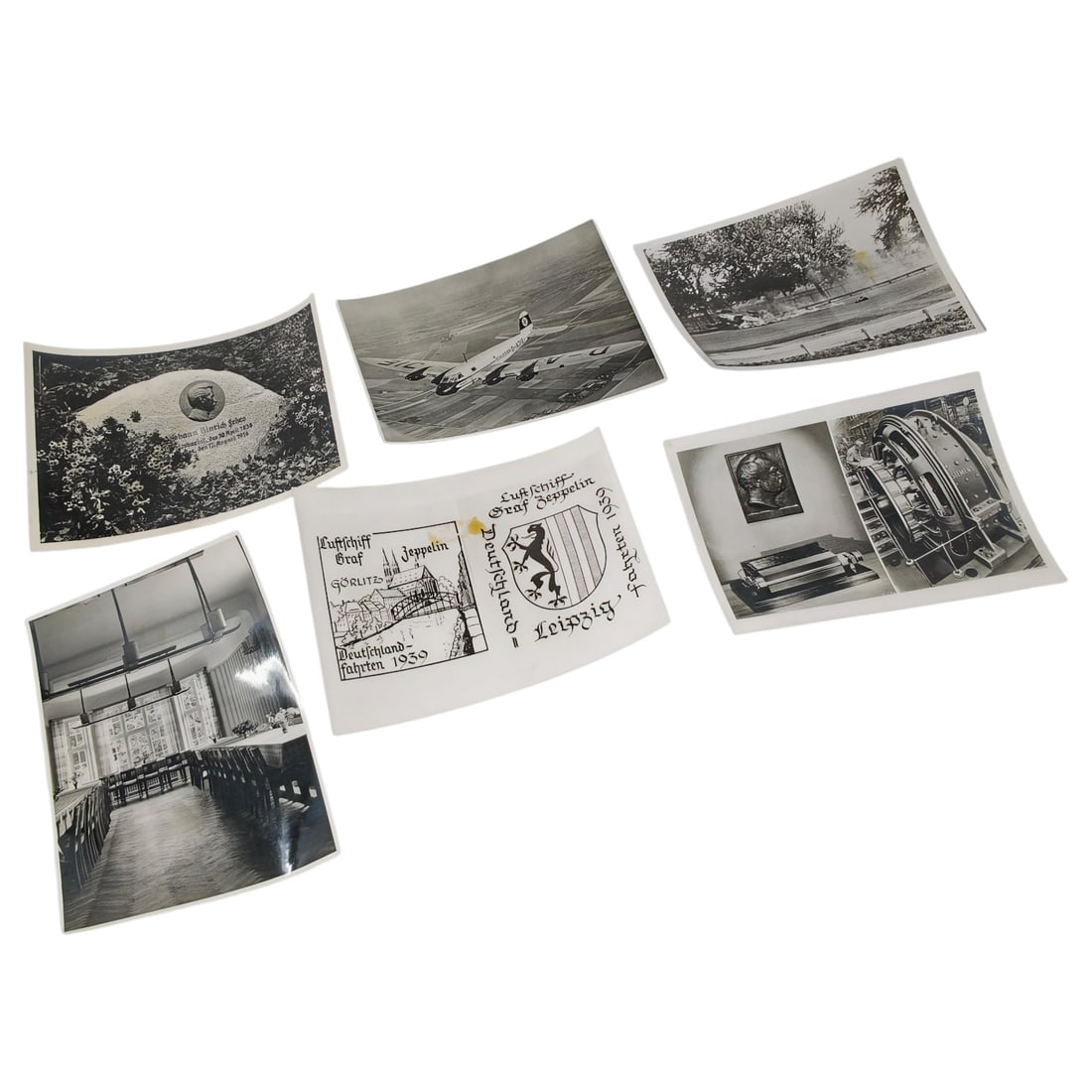 Set of German 1930s Press Photographs: A set of black and white photographs, a printed card with 1939 "Deutschland-Fahrten" itinerary text referencing Görlitz and Leipzig with a coat-of-arms motif, an interior view of a dining hall with l