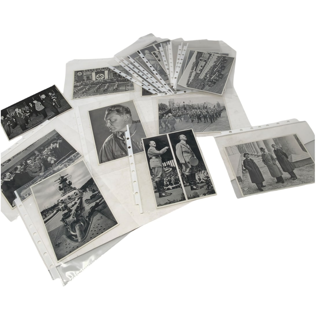 Set of Third Reich Era Propaganda Cigarette Cards: A set of black and white Cigarette Cards depicting Third Reich era subjects, including Hermann Göring in portrait and uniform, Adolf Hitler at rallies and public appearances, Nazi party rally grounds