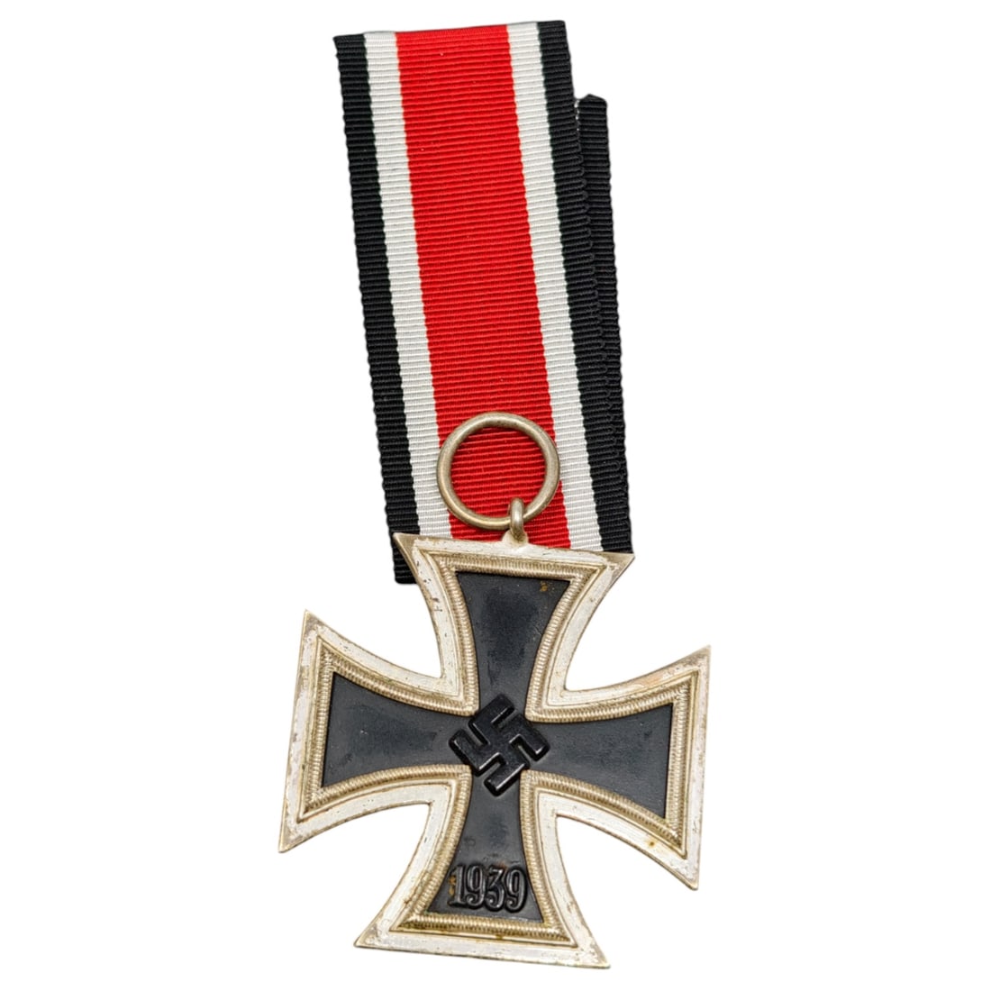 Third Reich German 1939 Iron Cross with Ribbon: A cross-form award with a beaded raised border, featuring a central mobile swastika device and the numeral 1939 on one face, and the numeral 1813 with a laurel-like plain field on the opposing face. T