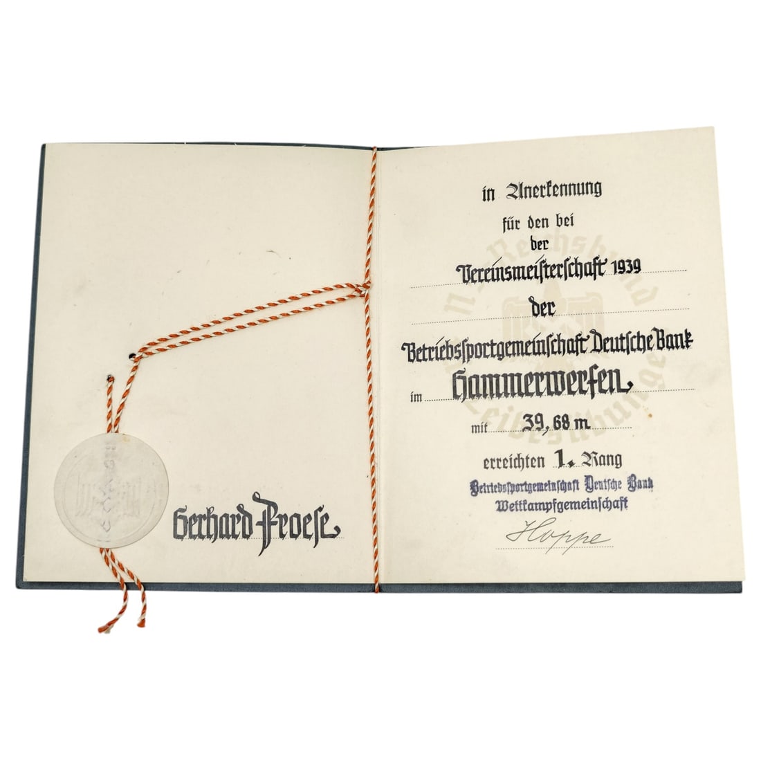 German 1939 Deutsche Bank Sports Award Document to Gerhard Froese for Hammer Throw: A folded award certificate presented in recognition of first place in the hammer throw event at the 1939 club championship (Vereinsmeisterschaft) of the Betriebssportgemeinschaft Deutsche Bank, the wo