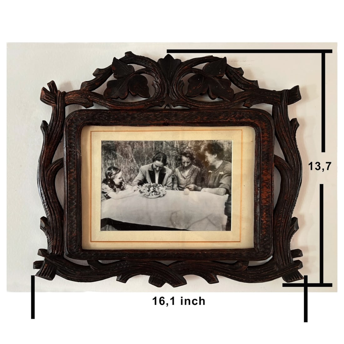 Framed Photo of Hermann Goering Family at Bavarian Home, in Original Carved Wood Frame: Original photograph depicting members of Hermann Goering's family seated around a table at their Bavarian home at Sackdilling, photographed on April 19, shortly after the war. A typed caption identifi