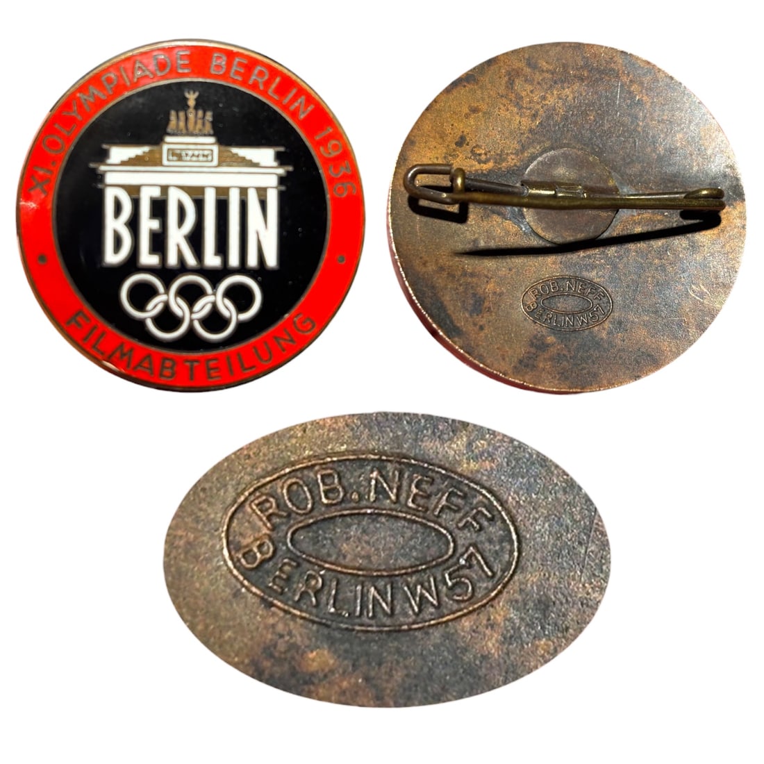 1936 Berlin Olympics 'Filmabteilung' Badge by Rob. Neff: A round badge inscribed "XI. OLYMPIADE BERLIN 1936 - BERLIN - FILMABTEILUNG" around a depiction of the Brandenburg Gate above the Olympic rings, identifying the holder as a member of the Film Departme