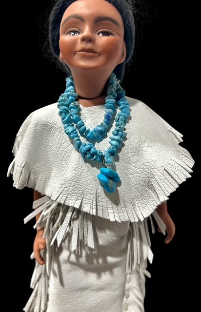 Brenda Stewart American Indian Jointed Woman Doll on Stand: Brenda Stewart American INdian Woman Doll on Stand. Beautiful White Leather Dress and Bindings with Suede Moccasins & Turquoise Necklace. Plaque on stand reads : Ashton Sosi & Etai Yazi by Brenda Stew