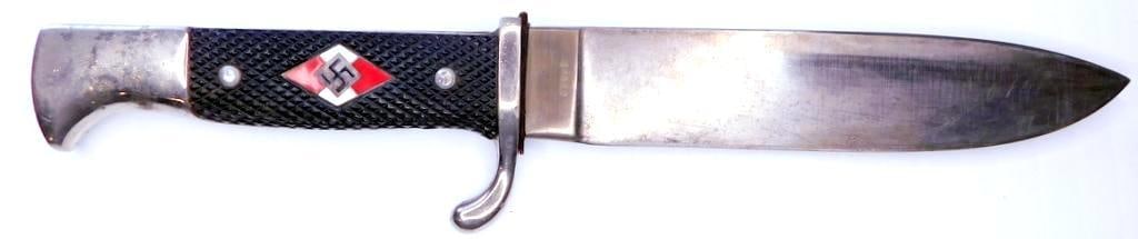 German WWII Hitler Youth HJ Knife and Scabbard: Front of the steel blade reads Blut und Ehre! (Blood and Honor!). Maker marked PIC on one side. The other side shows a pick stick into a mountain logo. Measures 10 inches long overall.