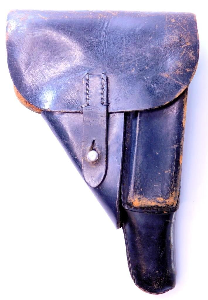 German WWII Walther P-38 Pistol Leather Holster: Multi-piece machine sewn black leather construction. Reverse side is maker marked and dated P38 bla 1944. It is also marked with a wafffen ampt eagle with WaA 159. Measures 6 1/4 inches wide by 9 3/8