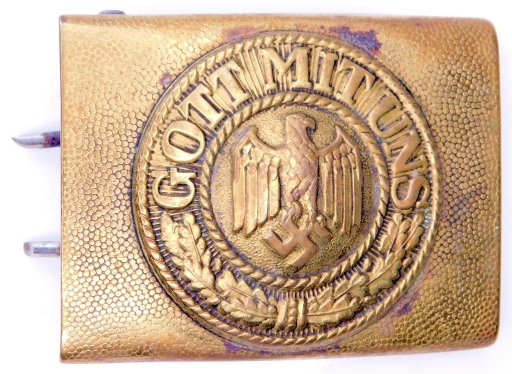 German WWII Naval Kreigsmarine EM Belt Buckle: Two piece die struck stamped brass construction. Front shows a German eagle clutching a swastika in his talons in the center. It reads GOT MIT UNS (God with Us). Includes the two prongs plus the belt 