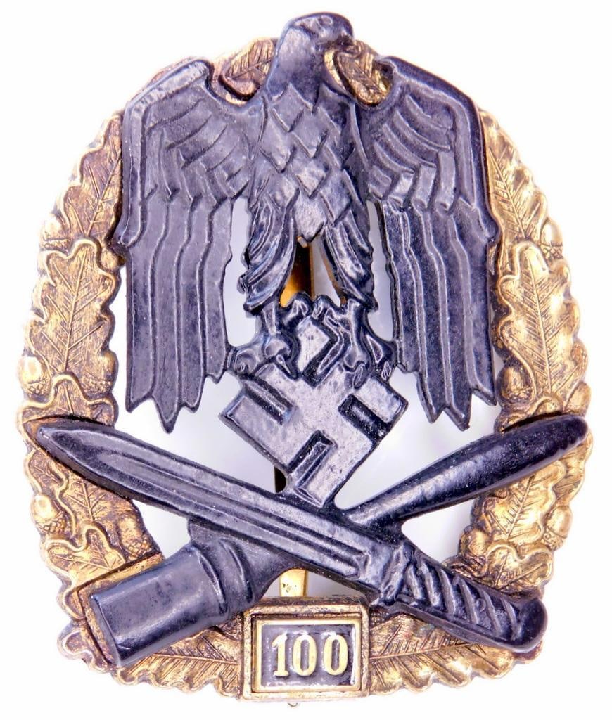 German WWII Army HEER 75 General Assault Badge: Two piece die struck four domed rivet brass and nickel construction. Front shows a bold German eagle clutching a swastika in his talons. Below is a crossed bayonet and potato masher stick grenade. All