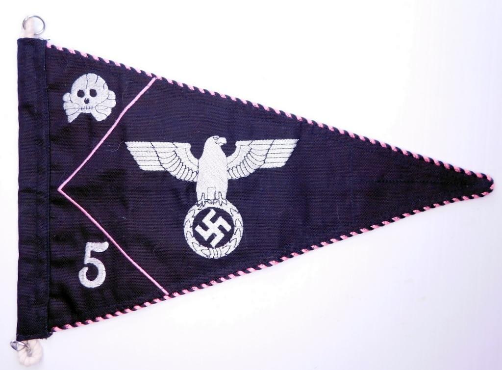 German WWII Army 5th Panzer Division Officers Staff Car Pennant: Multi-piece machine sewn and machine embroidered cotton construction. Double sided. The front side and the back side shows a skull and cross bones with a 5 below. Spread wing German eagle clutching a