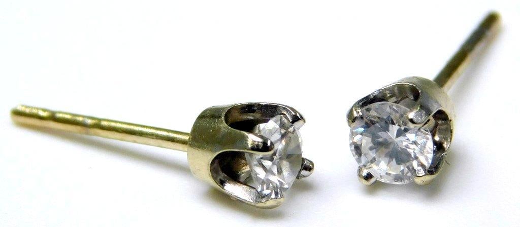 Stud Earrings w/ White Sapphire Stones: Very sparkly! Features claw-set round-cut white sapphire stones Prong settings, no backs Unmarked Sapphires measure 3.5mm