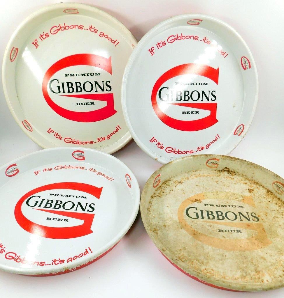 Set of Four Gibbons Beer Advertising Trays: Set of four Gibbons Beer advertising trays featuring the slogan If it's Gibbons ... It's good! prominently on each Made of metal, the trays have a round shape and feature the Gibbons beer logo in
