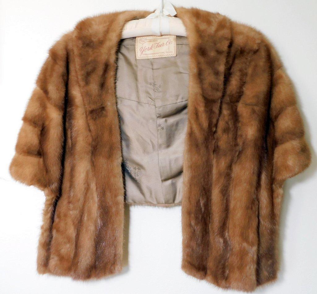 York Fur Co. Genuine Fur Stole w/ Embroidered Lining: Genuine fur stole by York Fur Co., featuring a rich brown tone and elegant craftsmanship The interior is lined with a smooth fabric that includes delicate floral embroidery Piece retains its original