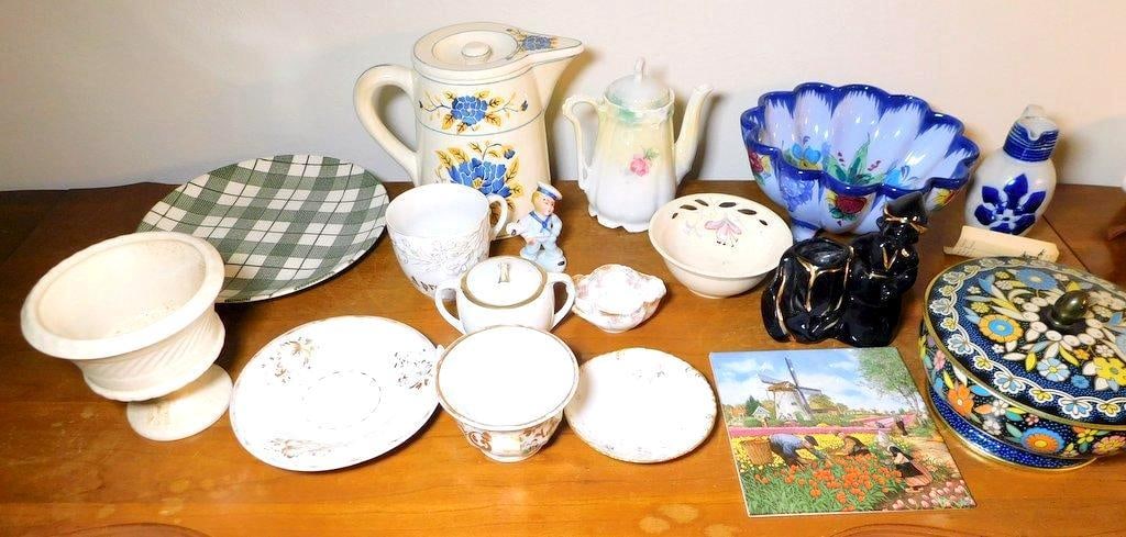 Decorative Around the World Houseware Collection: You get all shown here Pieces are porcelain, lidded container is tin/metal Includes: U.S., Japan, England, Germany and France Includes pitchers, cups, bowls, trivet tile, figurine, sugar and more Many