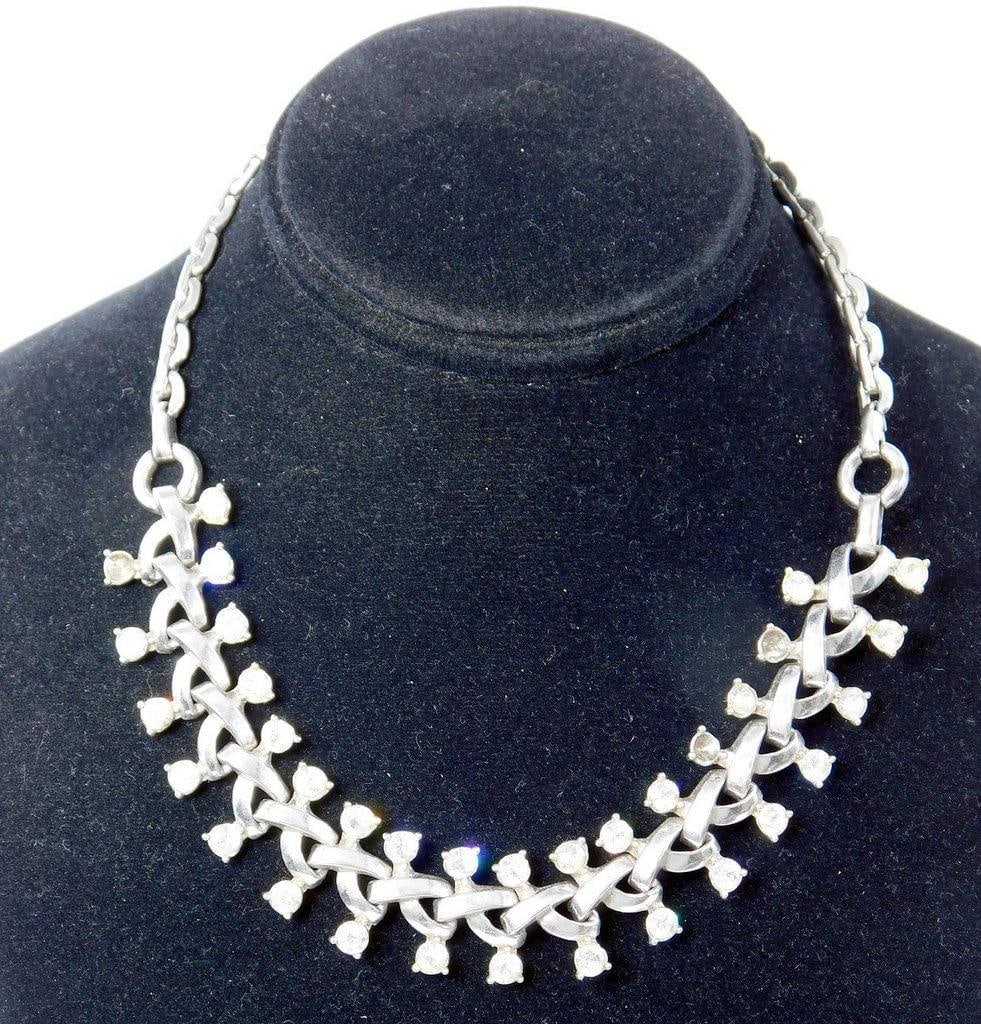 Barclay Woman's Signed Costume Jewelry Choker Necklace: Beautiful costume jewelry piece, signed Barclay on clasp This necklace features clear, prong-set rhinestones in a silver-tone metal, connected with an interlocking leaf or X pattern design Very good c