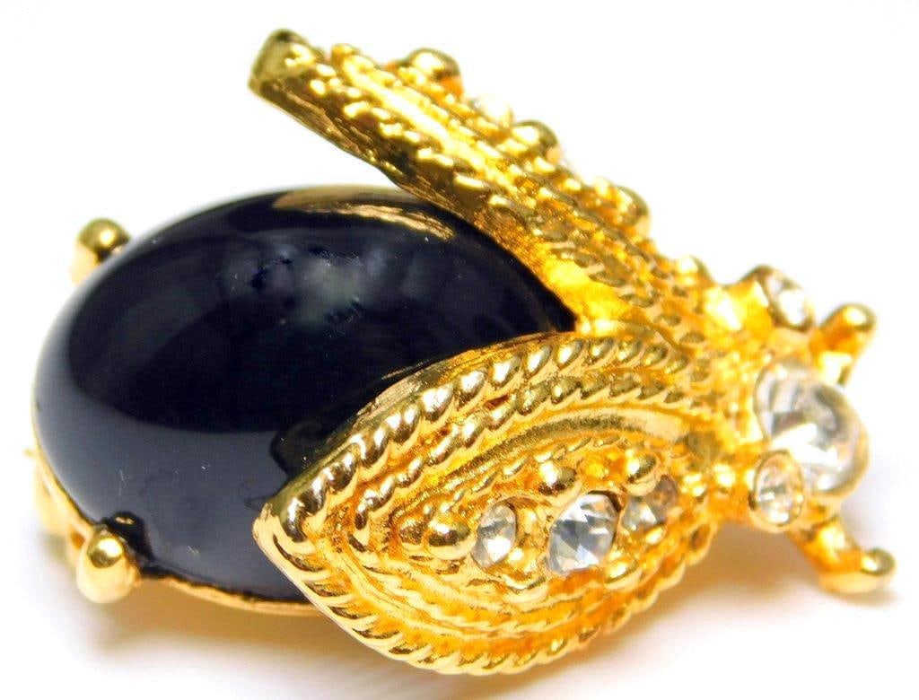 Kenneth Jay Lane Gold-Toned Brooch w/ Black Cabochon and Rhinestones: Beautiful looking Beetle Bug pin Very good condition Ready to impress Signed as shown Roughly 1 inch L