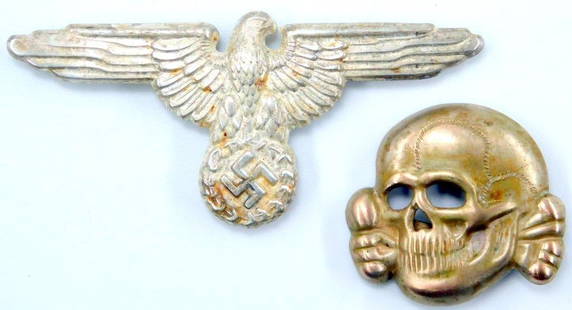Waffen SS Officers Visor Cap Eagle and Skull: Stamped nickel construction. Flat horizontal prongs on reverse. Both are maker-marked RZM M1/52 on the back. 