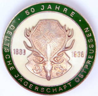 50-Year 1888 1938 Hunting Deutsche Jagerschaft DJ Badge: Two-piece die-struck vaulted nickel construction with green and white enamel. Front reads 1888 1938 50 Jahre Deutsche Jagerschaft Ostpreussen. DJ deer with a pair of antlers in the center 