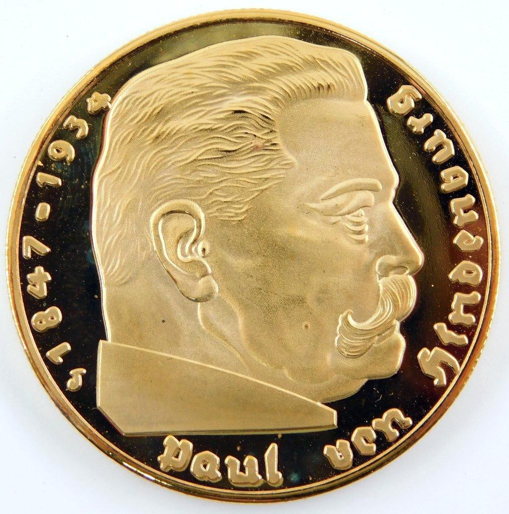 Chancellor Paul von Hindenburg 5 Mark Silver Coin: Mint BU condition. Front reads Paul von Hindenburg 1847 1934 and shows his bust profile image in the center. Reverse shows a German eagle clutching a swastika in his talons in the center. It read