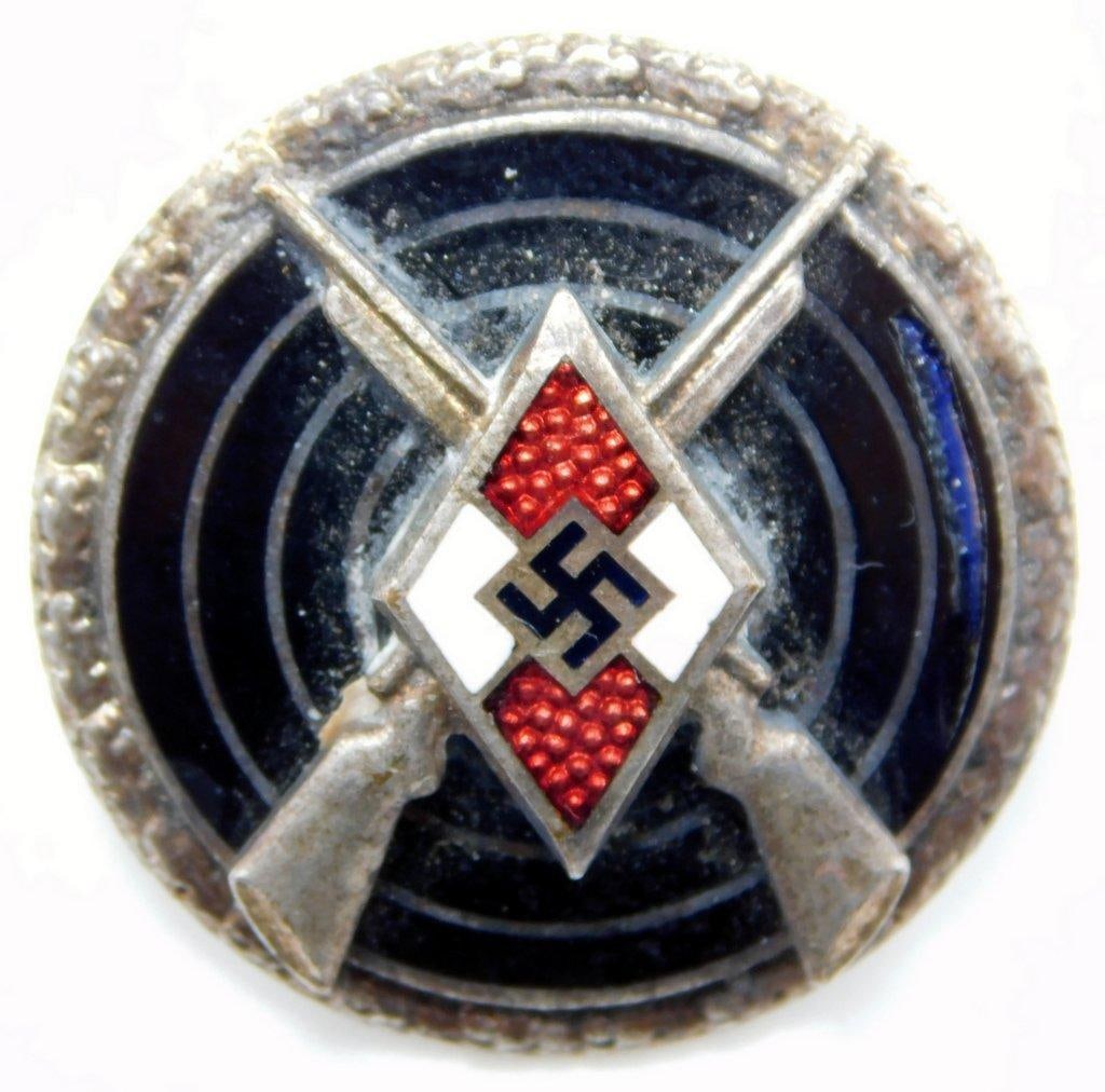 German WWII Senior Hitler Youth HJ Marksman Shooting Award: Two-piece die-struck vaulted nickel construction with enamel. Front shows a Hitler Youth diamond in the center with a pair of crossed rifles and a target in the background. Round oak leaf border. Reve