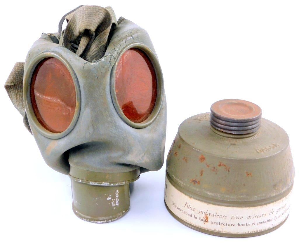 German WWII Army HEER Gas Mask and Canister: Includes the gas mask with filter, plus the OD green-painted canister and green canvas shoulder strap.