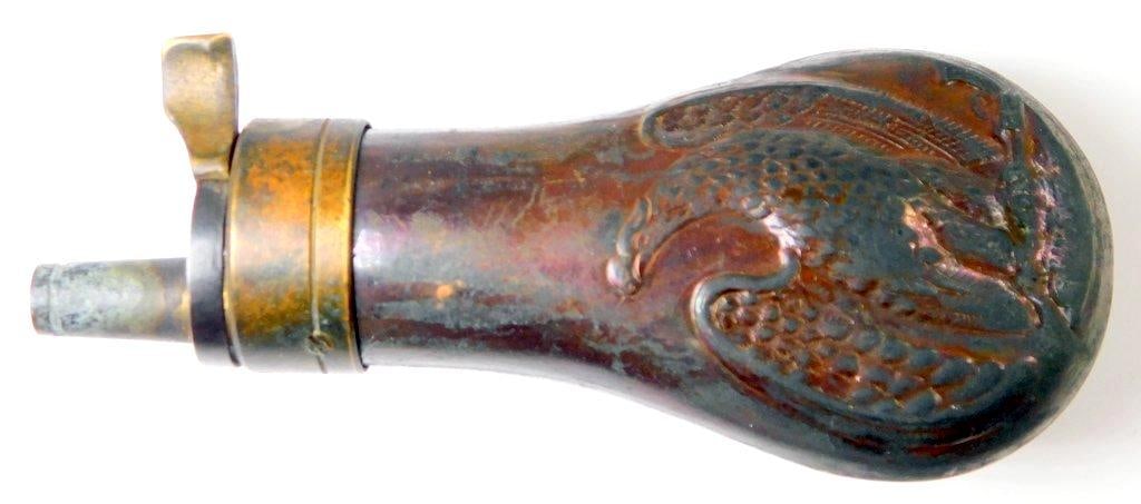 Old West COLT Pocket Model Pistol Gun Powder Flask: Multi-piece stamped copper and die-struck brass construction. Front and back show a spread-winged eagle standing on a pistol and rifle. Measures 1 3/4 inches wide by 4 1/4 inches tall by 1 inch deep.