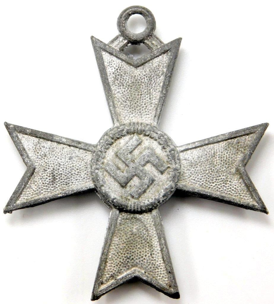 Knights Cross to the War Merit Cross without Swords: This neck order was awarded for meritorious service towards the war effort. Front shows a swastika in the center of a four-armed Maltese cross. Reverse is dated 1939. Measures 2 inches wide by 2 