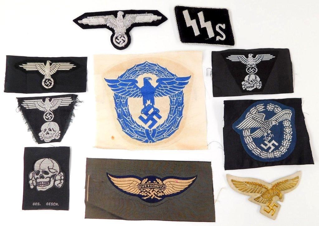 Cloth Insignia Grouping of Twelve (12): Cloth woven machine embroidered bevo cotton construction along with silver bullion wire construction. Includes: Waffen SS; Police; Luftschutz; and Luftwaffe.
