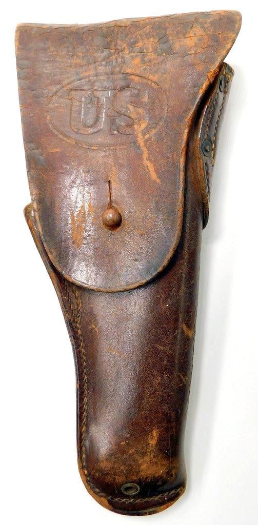 US WWI AEF Colt 45 Leather Pistol Holster: Multi-piece machine-sewn brown leather construction. There is a slight tear on the top of the holster. Front flap is marked with the letters US. Reverse is maker-marked and dated 1917 J.N.S. Meas