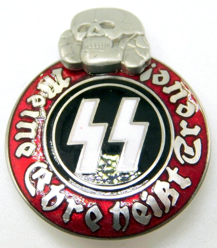 German WWII Waffen SS Schutz Staffel Membership Badge: Two-piece nickel construction with black, red, and white enamel. Front reads Meine Ehre heist Treue! (My Honor is Loyalty!). Pair of SS runics with a skull at the top. Reverse is maker-marked RZM M13/