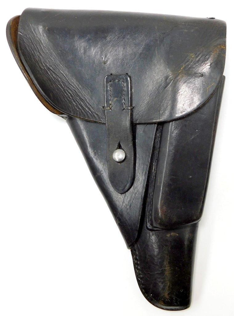 Scarce German WWII Walther P-38 Leather Pistol Holster: Multi-piece machine-sewn black leather construction. Scarce early war P-38 9 mm pistol holster. Reverse is marked P38 and maker-marked and dated cny 1940. Waffen ampt eagle clutching a swastika&n