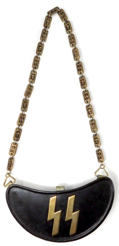 German WWII Waffen SS Runic Gorget: Die-struck stamped nickel construction. Front shows a pair of Waffen SS runics in the center. Includes the nickel skull and runic rotating neck chain. Measures 7 inches wide by 4 inches tall.