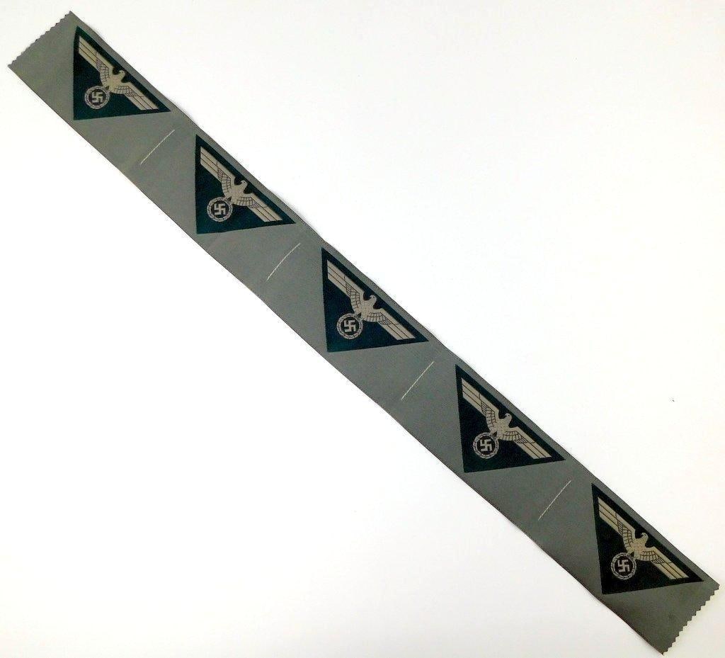 German WWII Army M-44 Enlisted Mans Breast Eagles, Five (5): Machine embroidered cloth woven bevo rayon construction. These were to have been sewn above the right uniform breast pocket. Front shows a spread-winged eagle clutching a swastika. Strip measures