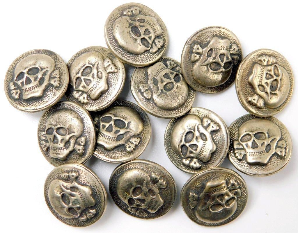 German WWII Waffen SS Skull Uniform Buttons, Group of Thirteen (13): Two-piece die-struck vaulted nickel construction. Front shows the Waffen SS skull and crossbones in the center of the button. Reverse is maker-marked RZM 5/8. Includes the shank on the back of each bu