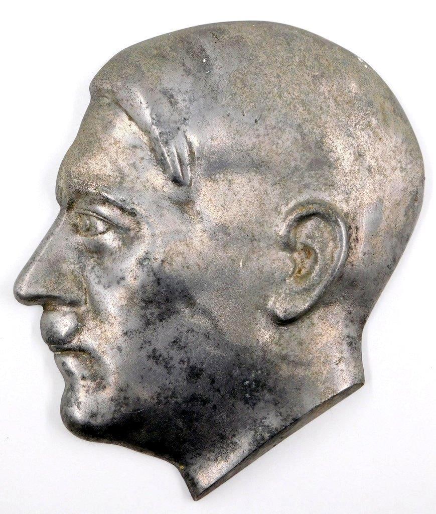 Metal Hitler Profile Plaque, Brought from WWII Germany, May 1945: Metal profile plaque removed from a building in Germany at very end of war. Featuring a Hitler's head in raised relief. On the reverse is handwritten: Adolph Hitler, brought from Germany May 1945