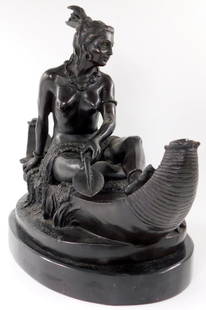 After Duchoiselle (French 19Th C.) Bronze Sculpture, Indian Maiden In A Canoe Statue: Metal statue of Native American Woman Depicting a female American Indian in a canoe Dark patina Presented on a black marble base Showing signature as&nbsp;Duchoiselle This piece has incredible eleganc