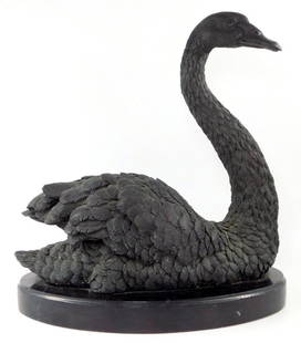 Black Swan Metal Sculpture on Marble Base: A detailed black swan sculpture crafted from a dark metal material, depicting realistic feather texture and lifelike anatomy The swan is mounted on a marble black base, enhancing its display 