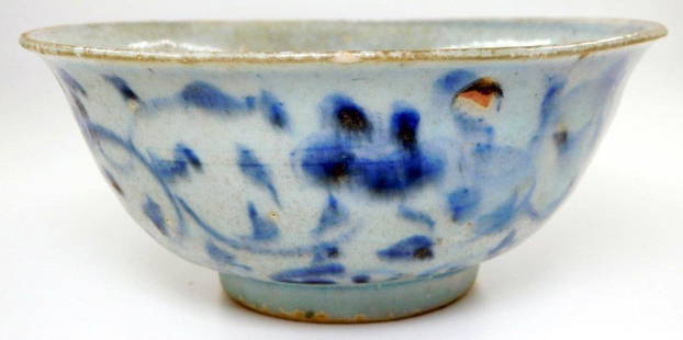 Qing Dynasty Blue and White Ceramic Bowl with Floral Motif: A ceramic bowl featuring a blue and white floral motif, attributed to China Qing Dynasty as shown on bottom label The bowl exhibits a circular foot and soft glaze, with a label on the base reading Nat