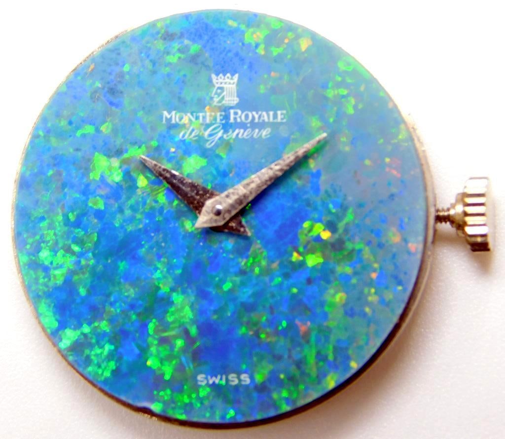 Montre Royale de Geneve Opal Dial Swiss Watch Movement: Montre Royale de Geneve mechanical watch featuring their famous vibrant opal dial The watch is Swiss-made, with a visible manual movement of 17 jewels, marked 4109 The movement is inscribed with Montr
