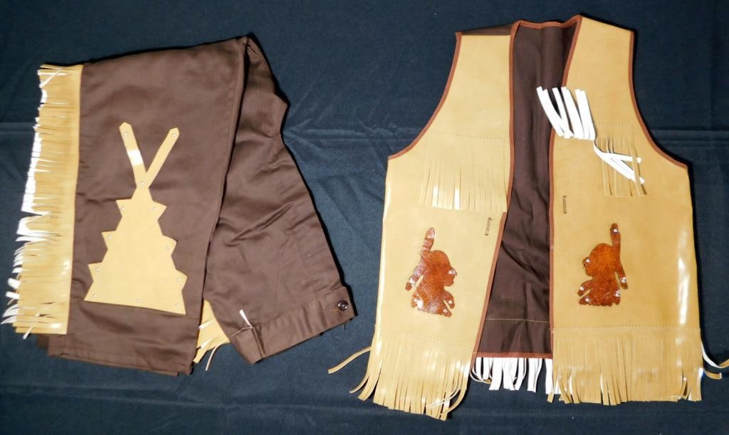 Native American Brown Leather Fringed Child Play Clothing Vest and Pants Set: Classic play toy clothing Includes a brown leather fringed vest and matching pants featuring decorative embellishments The vest has a brown fabric back with fringe details and appliques depicting