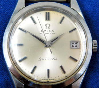 Omega Seamaster Automatic Men's Watch w/ Date Display: Classic Omega Seamaster automatic men's wristwatch featuring a stainless steel case and bracelet The watch is equipped with a silver-tone dial, black baton hour markers, and automatic calender&nbsp;da