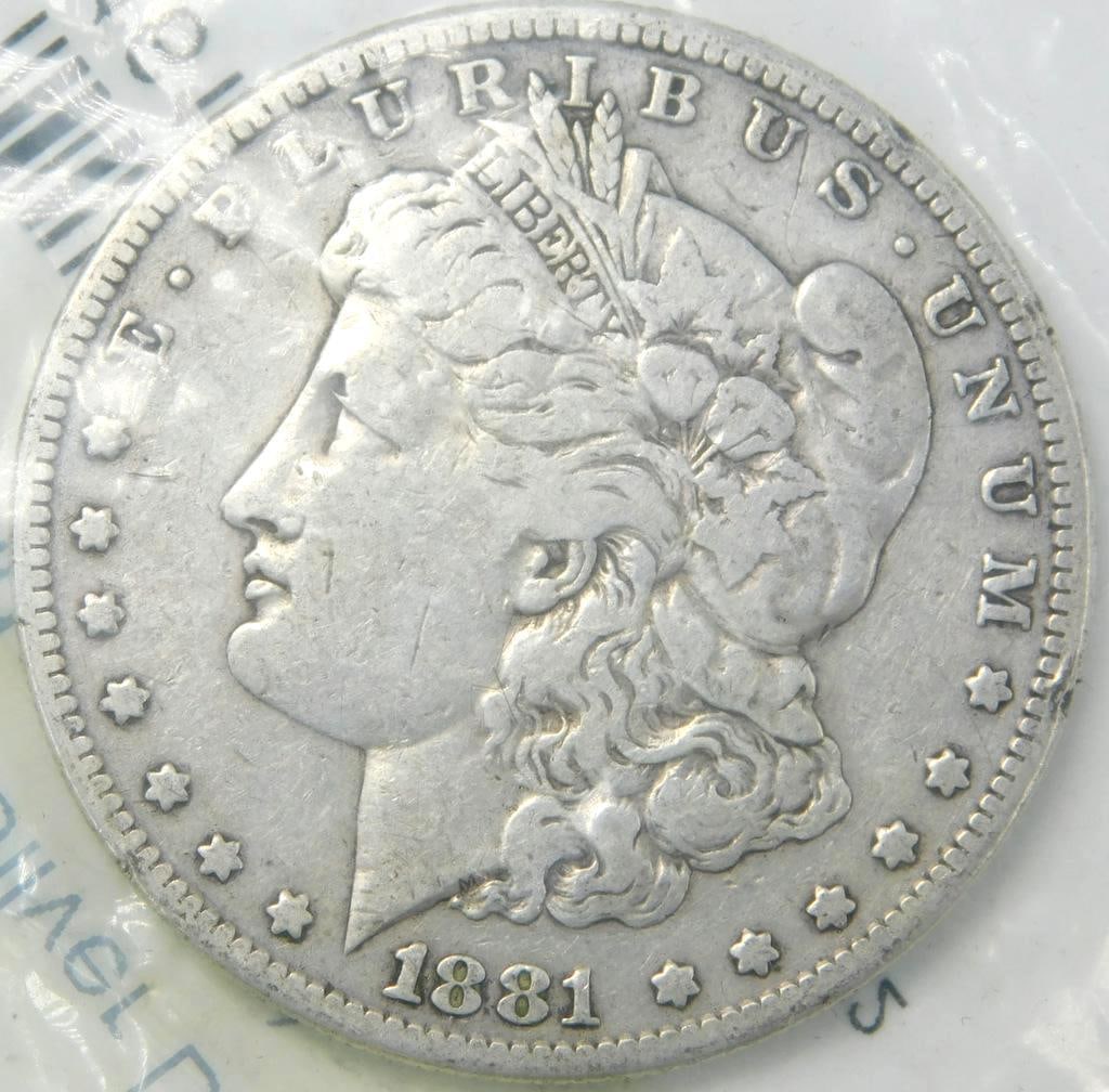 1881 S Morgan Silver Dollar Coin: Designed by George T. Morgan, with circulated condition In APMEX plastic bag