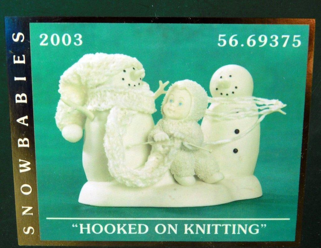 Department 56 Snowbabies 2003 Hooked on Knitting Figurine w/ Original Box: Department 56 Snowbabies 2003 Hooked on Knitting figurine (item 56.69375) Includes original packaging and box with green star design The figurine displays two snowmen and a Snowbaby in a